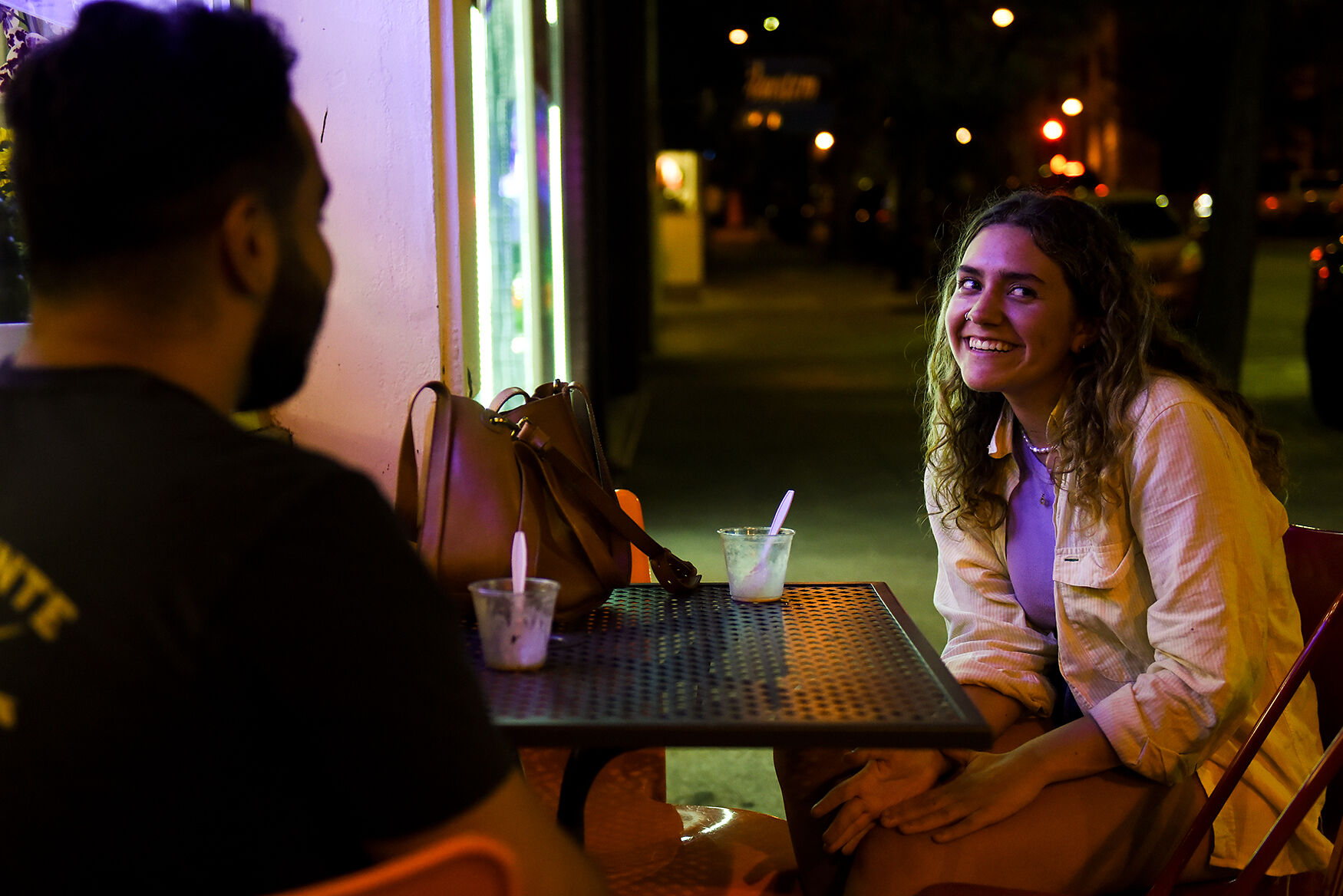 Julien Sanjur, left, and Karen Stephen eat ice cream on their first date at Sparkys